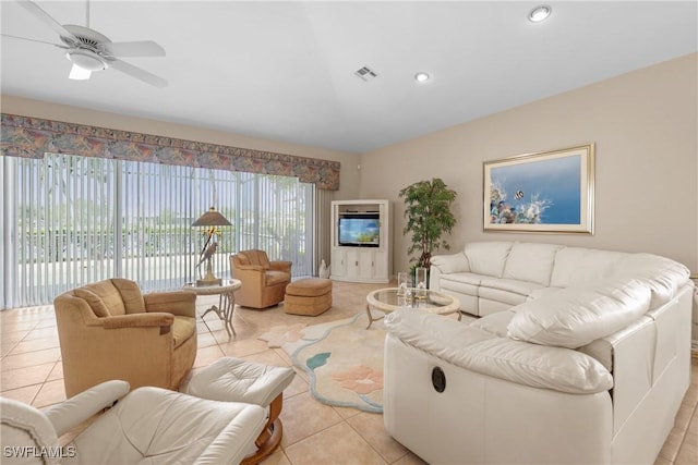 living room featuring ceiling fan and light tile patterned flooring