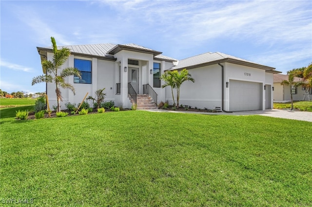 view of front facade with a front yard and a garage