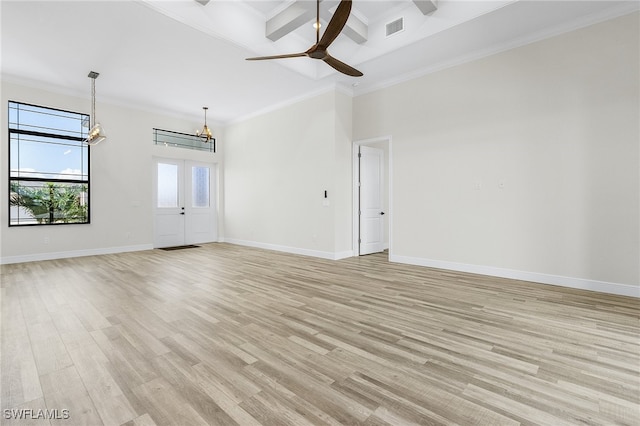 spare room featuring coffered ceiling, beamed ceiling, light hardwood / wood-style flooring, ornamental molding, and ceiling fan