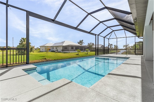 view of pool with a patio, a lanai, and a lawn