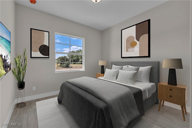 bedroom with light hardwood / wood-style floors