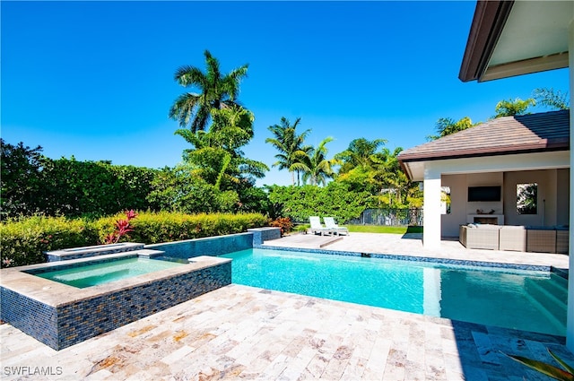 view of swimming pool with an in ground hot tub and a patio area