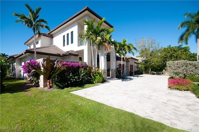 view of property exterior with a lawn