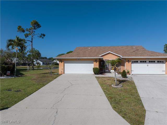 ranch-style home with a front lawn and a garage