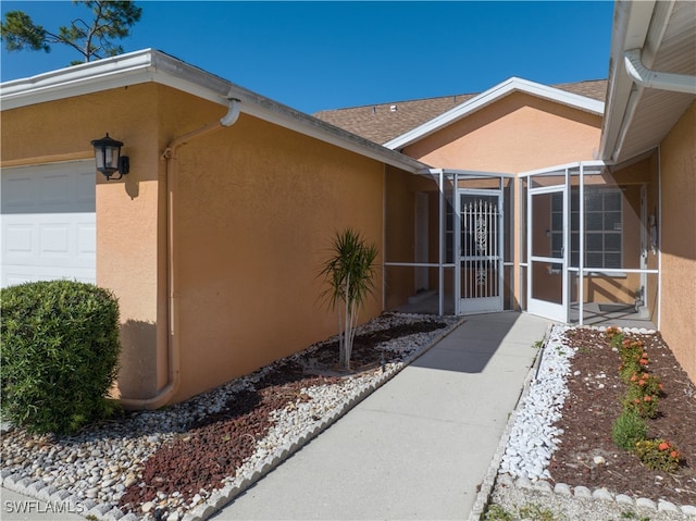 property entrance with a garage