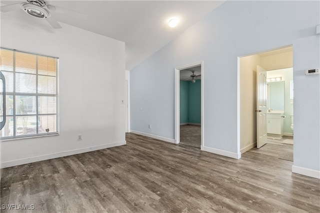 interior space featuring lofted ceiling, wood-type flooring, and ceiling fan