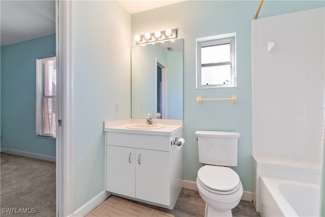 bathroom featuring toilet and vanity