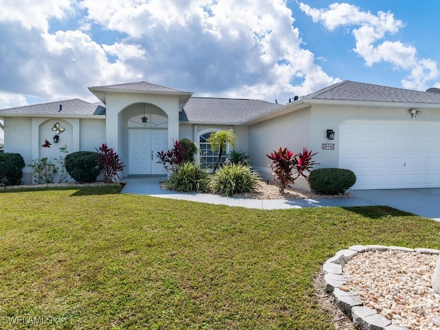 ranch-style home with a front yard and a garage