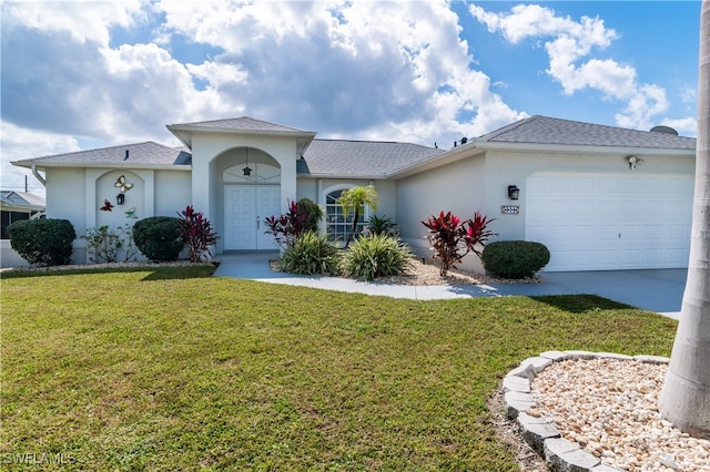 ranch-style house with a garage and a front lawn