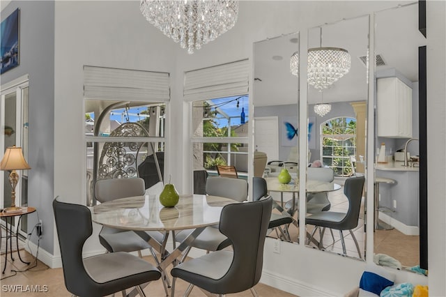 tiled dining space with a wealth of natural light and a notable chandelier