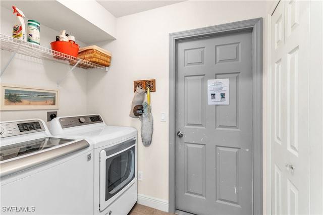 washroom with independent washer and dryer and light tile patterned floors