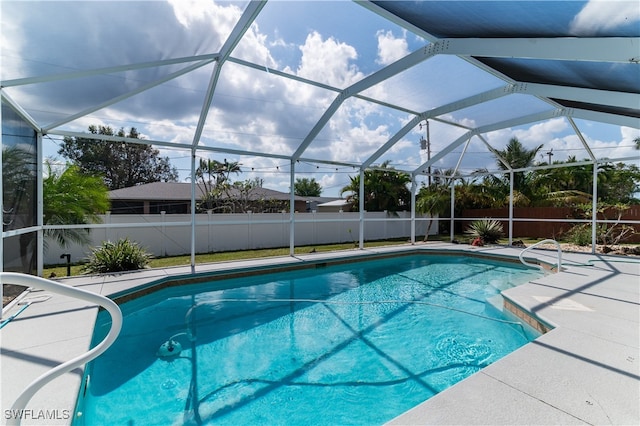 view of pool featuring a lanai and a patio area