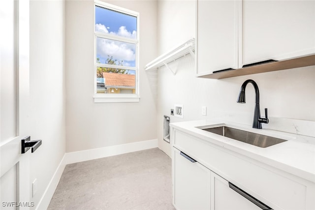 laundry area featuring cabinets, hookup for a washing machine, sink, and electric dryer hookup