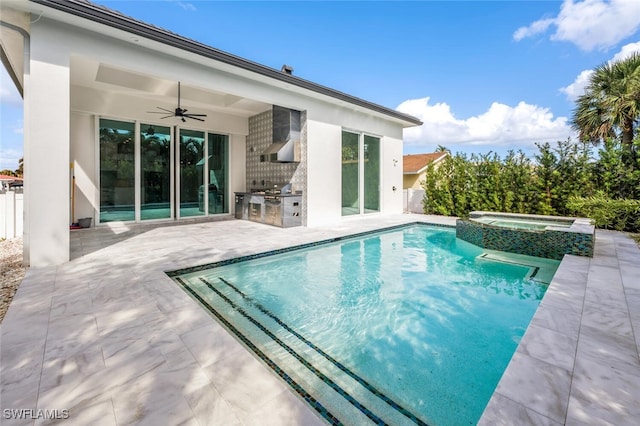 view of pool with ceiling fan, a patio, a grill, an outdoor kitchen, and an in ground hot tub