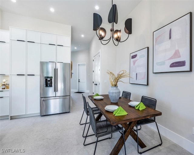 dining area with an inviting chandelier