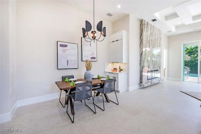 dining space with an inviting chandelier