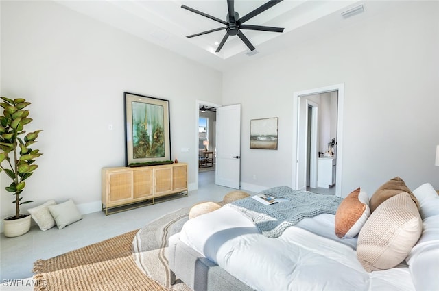 bedroom featuring a towering ceiling, ceiling fan, and ensuite bathroom