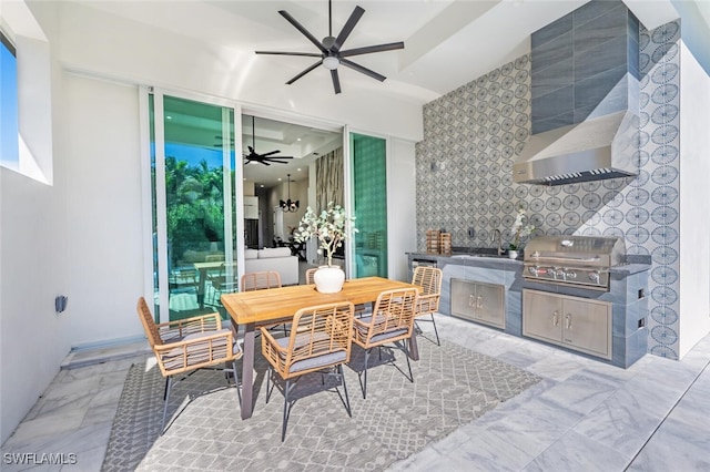 interior space with an outdoor kitchen, area for grilling, and ceiling fan