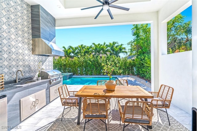 view of patio with area for grilling, an outdoor kitchen, sink, and ceiling fan