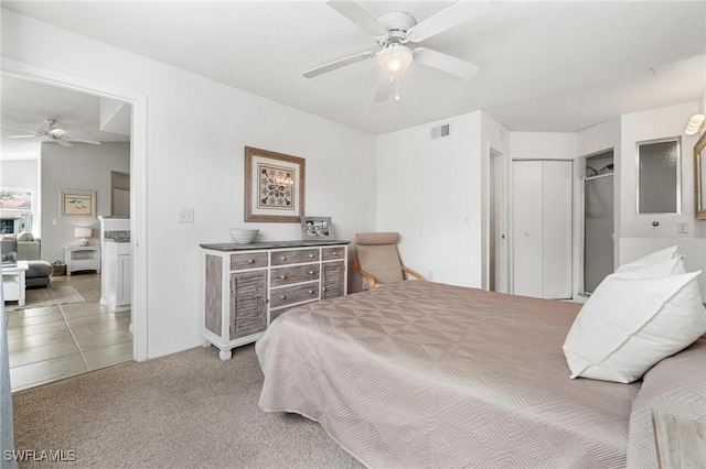 carpeted bedroom featuring ceiling fan