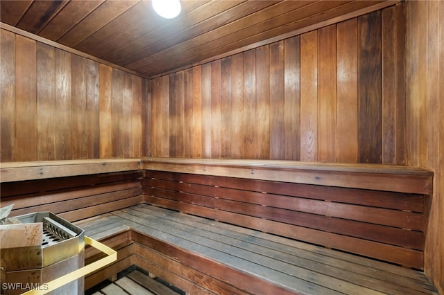 view of sauna / steam room featuring wood walls and wooden ceiling