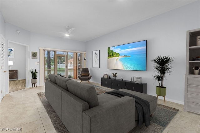 tiled living room with ceiling fan