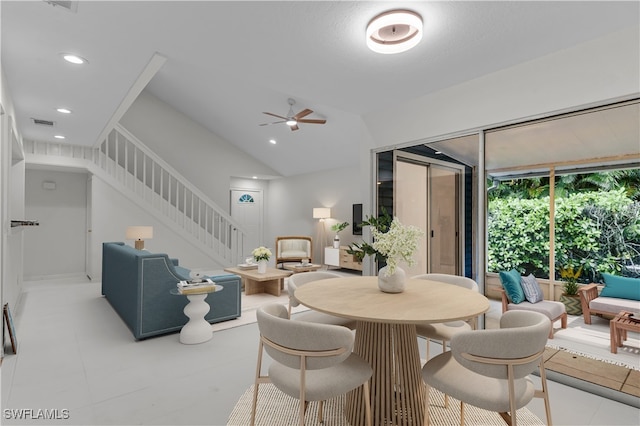 dining room with ceiling fan and vaulted ceiling