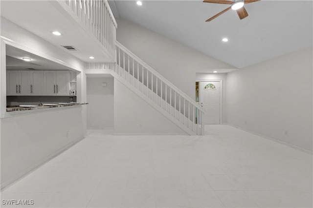 living room with high vaulted ceiling and ceiling fan