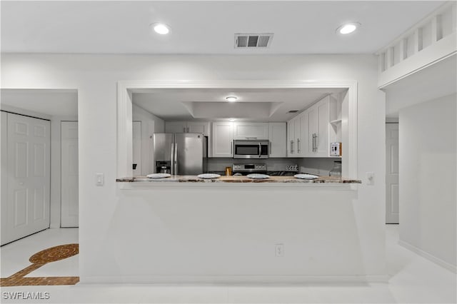 kitchen featuring kitchen peninsula and stainless steel appliances