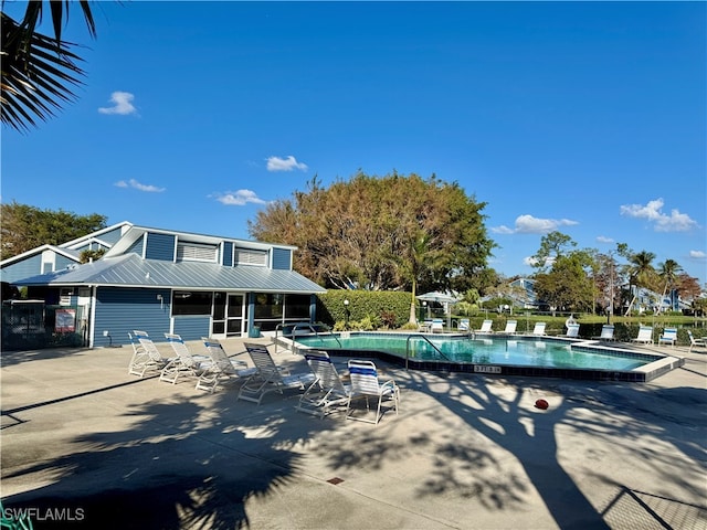 view of swimming pool with a patio