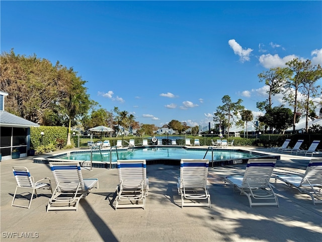 view of swimming pool with a patio