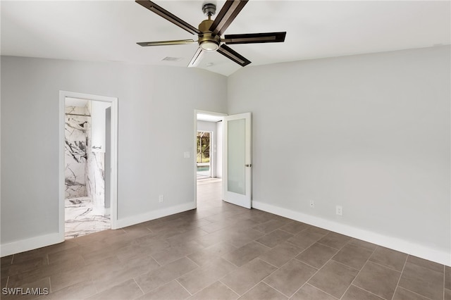 empty room with ceiling fan and lofted ceiling