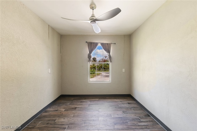 unfurnished room featuring ceiling fan and dark hardwood / wood-style floors