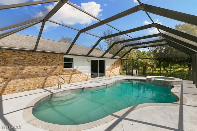 view of swimming pool with a patio, a lanai, and an in ground hot tub