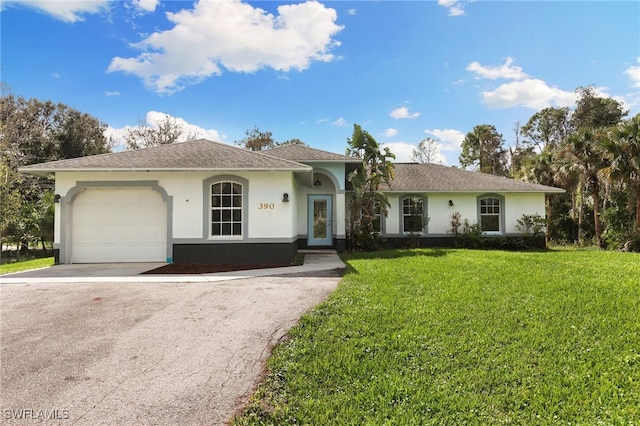 ranch-style home with a front yard and a garage