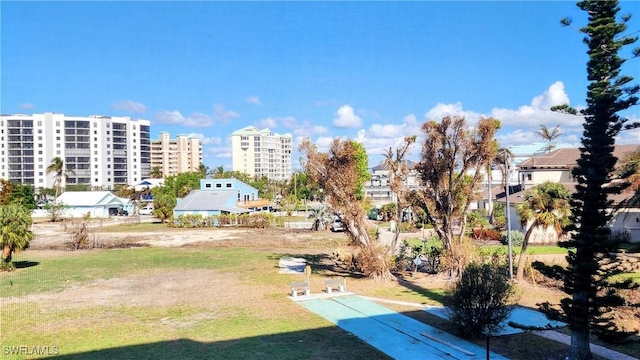 view of yard with a view of city