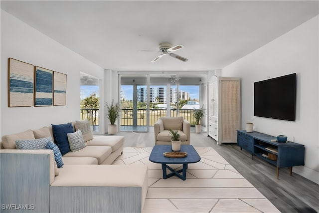 8401 Estero Blvd Unit 204, Fort Myers Beach, FL 33931 - living area with a ceiling fan, healthy amount of natural light, and wood finished floors
