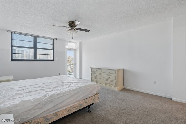 8401 Estero Blvd Unit 204, Fort Myers Beach, FL 33931 - bedroom with a textured ceiling, carpet floors, a ceiling fan, and baseboards