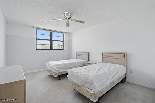 8401 Estero Blvd Unit 204, Fort Myers Beach, FL 33931 - carpeted bedroom featuring ceiling fan, a textured ceiling, and baseboards