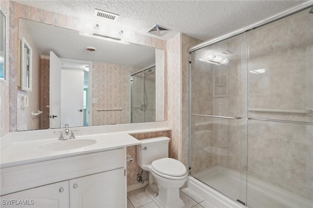 8401 Estero Blvd Unit 204, Fort Myers Beach, FL 33931 - bathroom featuring a textured ceiling, a shower stall, toilet, tile patterned flooring, and vanity