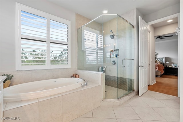 bathroom featuring separate shower and tub and tile patterned flooring