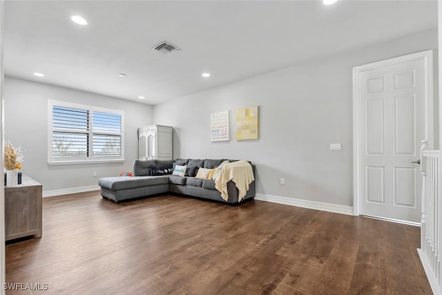 living room with dark hardwood / wood-style floors