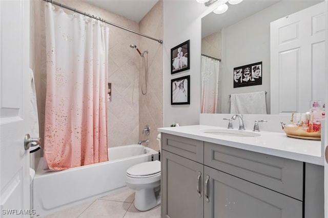 full bathroom with vanity, shower / bath combo with shower curtain, toilet, and tile patterned flooring