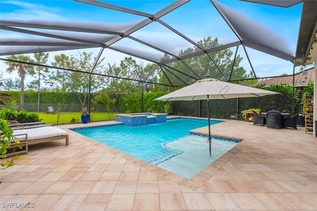 view of swimming pool with an in ground hot tub, a patio area, and a lanai