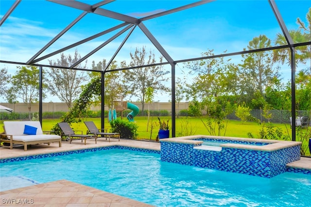 view of swimming pool with an in ground hot tub, a patio, and glass enclosure