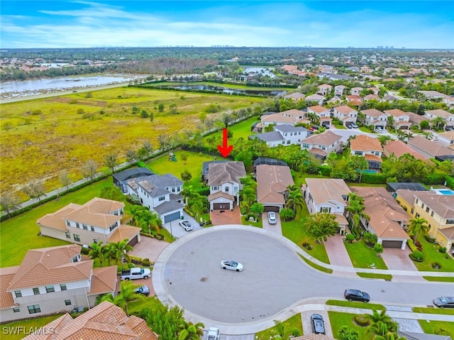 bird's eye view with a water view