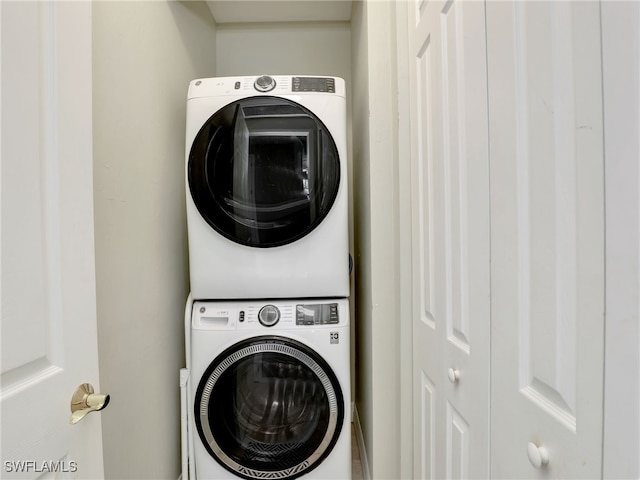 laundry room featuring stacked washing maching and dryer