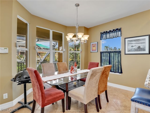 tiled dining room featuring a notable chandelier