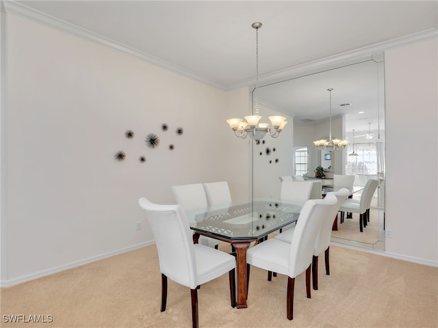 dining area featuring crown molding, a notable chandelier, and light colored carpet