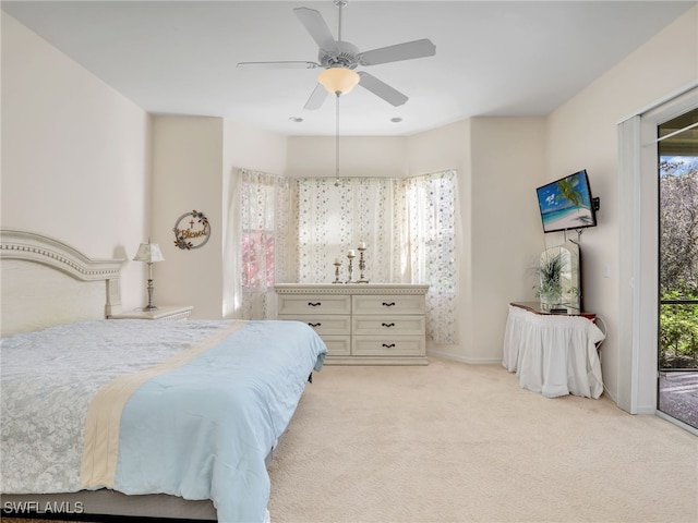 carpeted bedroom featuring access to outside and ceiling fan